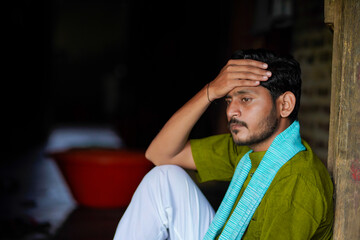 Young Indian farmer in depression and stress
