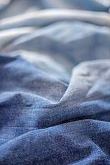 three gradients of denim from light blue to dark blue, fabric texture, vertical