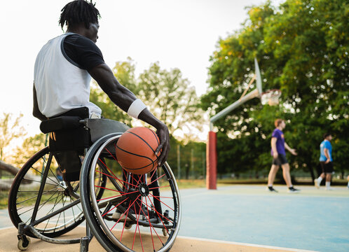 Paraplegic basketball player in wheelchair waiting for playing.