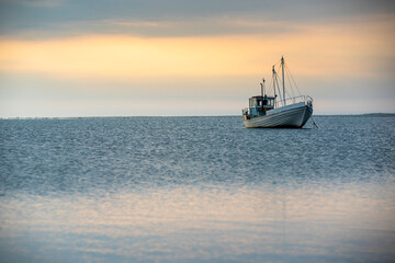 fishing boat on the sea at sunset, sunset by the sea with boat