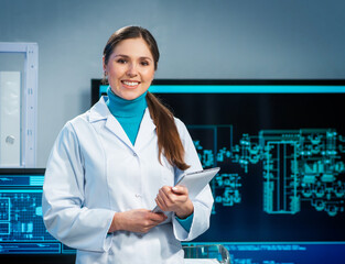 Workplace of young woman in modern microelectronics manufacturing lab. Engineer works in a modern...