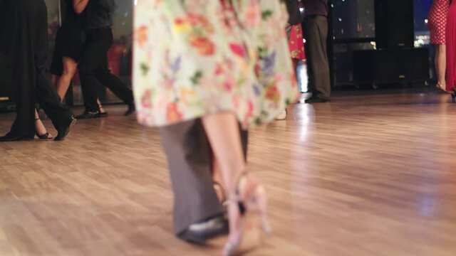 Tango dance : feet of dancers while dancing, close-up
