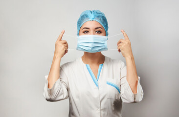 Doctor wearing medical mask, close-up portrait