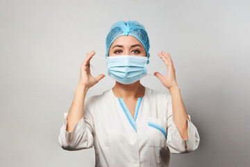 Fototapeta na wymiar Doctor wearing medical mask, close-up portrait