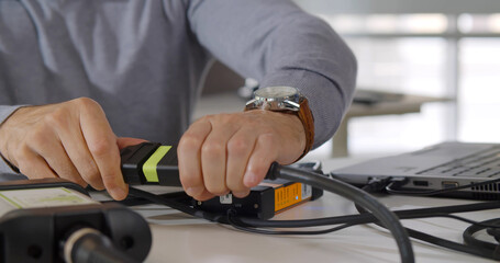 Cropped shot of it technician repair laptop in office