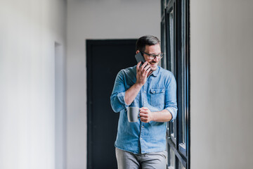 Confident smiling young successful cheerful casual entrepreneur businessman on coffee break talking...