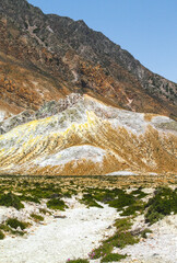 Deposits on the rocks surrounding the Stefanos crater of the volcano on the island of Nisyros
