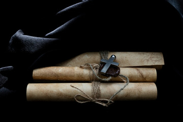 Cross and medieval scrolls.