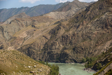 Naklejka na ściany i meble mountain gorge with the flowing turbid turquoise river katunya siberia russia 