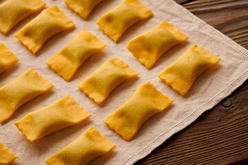 Raw homemade ravioli pasta with spinach and ricotta