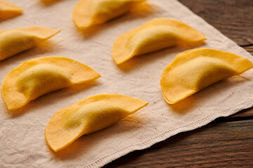 Raw homemade ravioli pasta with spinach and ricotta