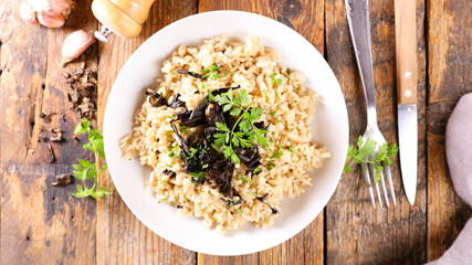 mushroom risotto and herbs on plate
