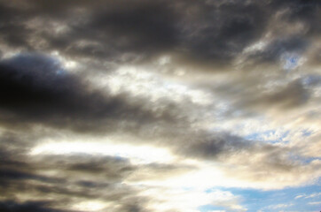 Dark rainy clouds. Dangerous rain cloud, storm cloud before a thunderstorm. Sky covered with rainy clouds. Abstract background