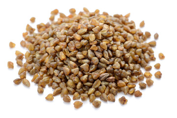 uncooked bitter buckwheat isolated on the white background