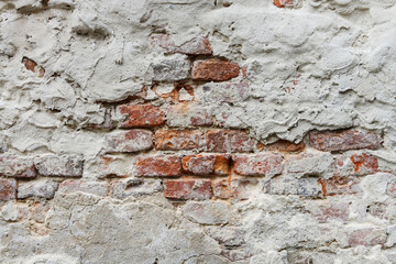 Abstract background: a composition of brick, plaster and cement.