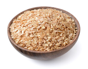 uncooked wheat bran in the wooden bowl, isolated on the white background