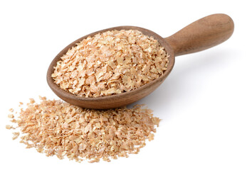 raw wheat bran in the wooden spoon, isolated on the white background