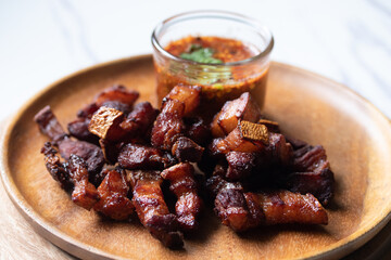 Deep fried pork belly with fish sauce and jaew sauce.Thai food