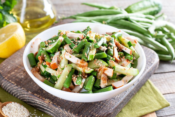 Salad with green beans, chicken and cucumber. Hearty lunch