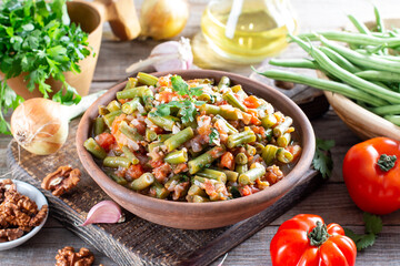 Traditional Caucasian Georgian lobio of green beans with vegetables and tomato