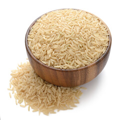 uncooked long brown rice in the wooden bowl, isolated on white