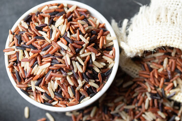 Jasmine Brown Rice in wooden bowl with copy space, Thai rice varieties Top view