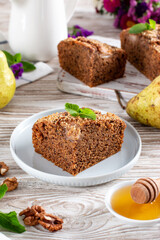 Homemade chocolate cake with pears on table