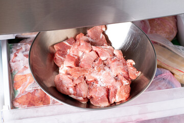 Frozen raw meat in the freezer. Concept of healthy eating.