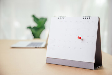 Calendar desk place on the table. Desktop Calender for Planner to plan agenda, timetable, appointment, organization, management each date, month, and year on wooden office table. Calendar Concept.