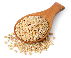 close up of raw steel cut oats in the wooden spoon, isolated on white. (large depth of field, taken with tilt shift lens)
