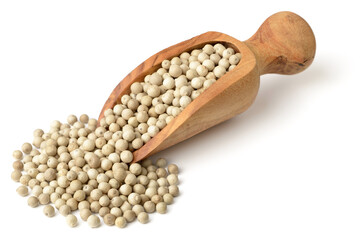 whole white peppercorns in the wooden scoop, isolated on the white background