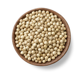 whole white peppercorns in the wooden plate, isolated on the white background, top view