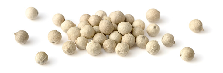 closeup of whole white peppercorns isolated on the white background