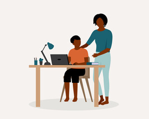 Black Young Mother Teaching Her Son Doing His Schoolwork At Home. Online School During COVID-19 Pandemic. Remote School Education. Distance Learning.