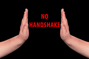 no handshake concept. isolated handshake prohibition sign on black background. in the middle of...
