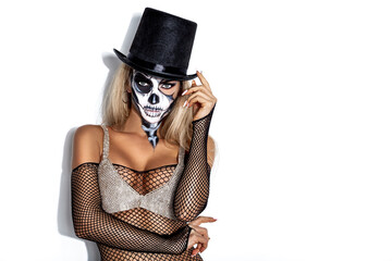 Female model in Halloween silence. Sexy woman in  skull make up on white background. Halloween...