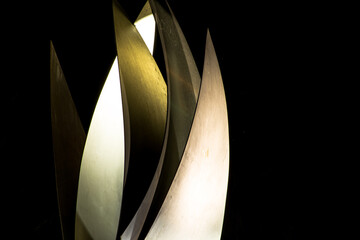 abstract sail statue in a roundabout in italy