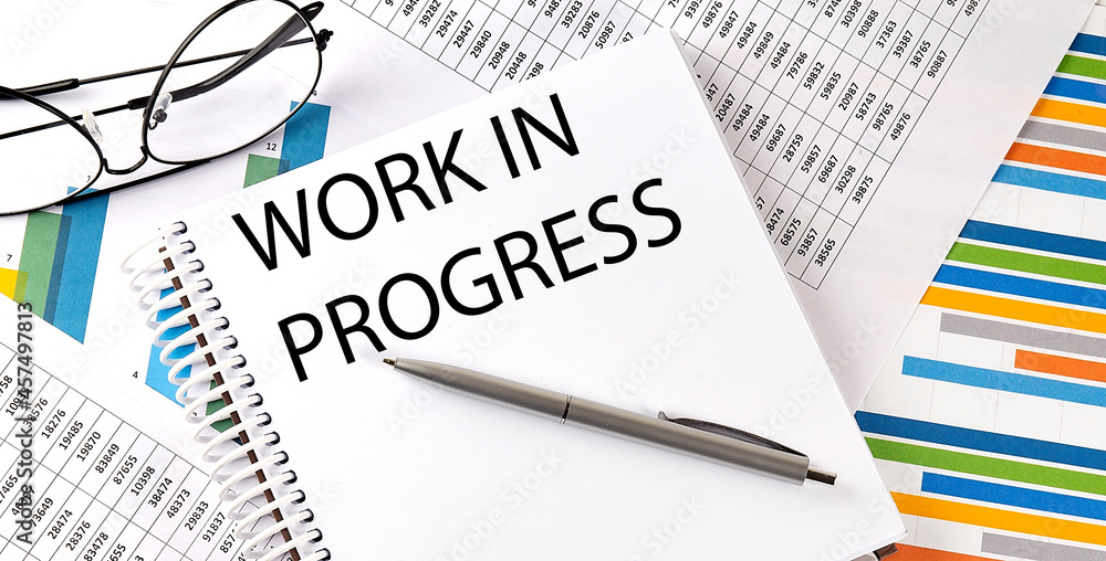 Poster notebook with text work in progress . diagram and white background,business concept