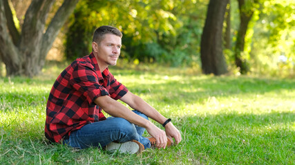 Man resting in park outdoors.