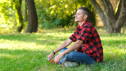 Fototapeta premium Man resting in park outdoors