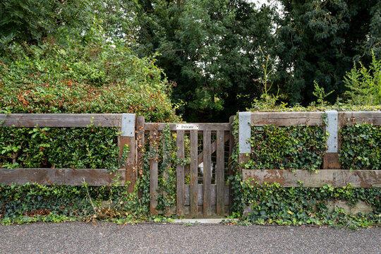 Private gate adjacent to a private house. Leading to a private mooring area for the home owners boat, moored inland.