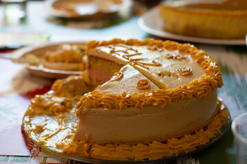 Delicious Latin vanilla cake with a lot of dulce de leche and with sweet pink in the center. Concept: delicious celebratory dessert, for birthday celebration