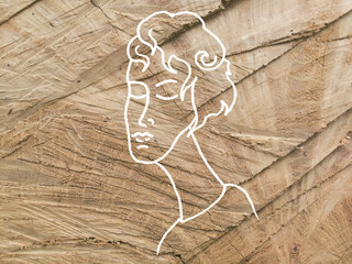 Szkic twarzy kobiety na drewnianym tle. - obrazy, fototapety, plakaty