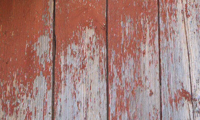 Wooden background - the red old paint peeling off