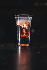 an alcoholic shot is a brain tumor. a glass of alcohol