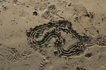 heart shape made in sand