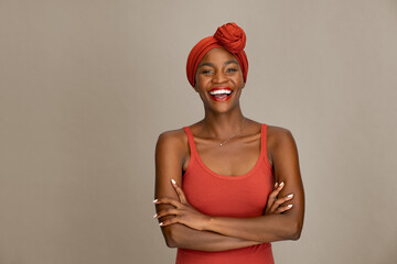 Beautiful african woman with headscarf laughing - obrazy, fototapety, plakaty