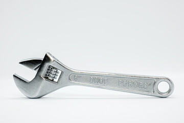 Drop forged adjustable wrench with chrome finish for maximum resistance against corrosion on white...