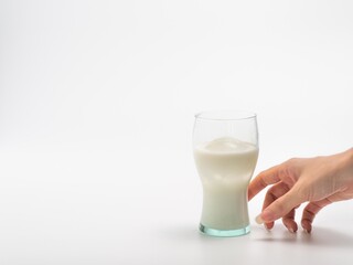 Hand hold milk with ice