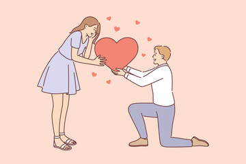 Love, romance and dating concept. Young happy smiling loving Man and woman connecting halves of big red heart feeling in love vector illustration 